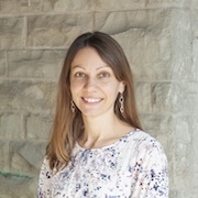 Portrait photo of Christina Booker smiling. White woman, long brown hair. 